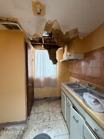 a bathroom with a granite countertop sink a toilet and bathtub