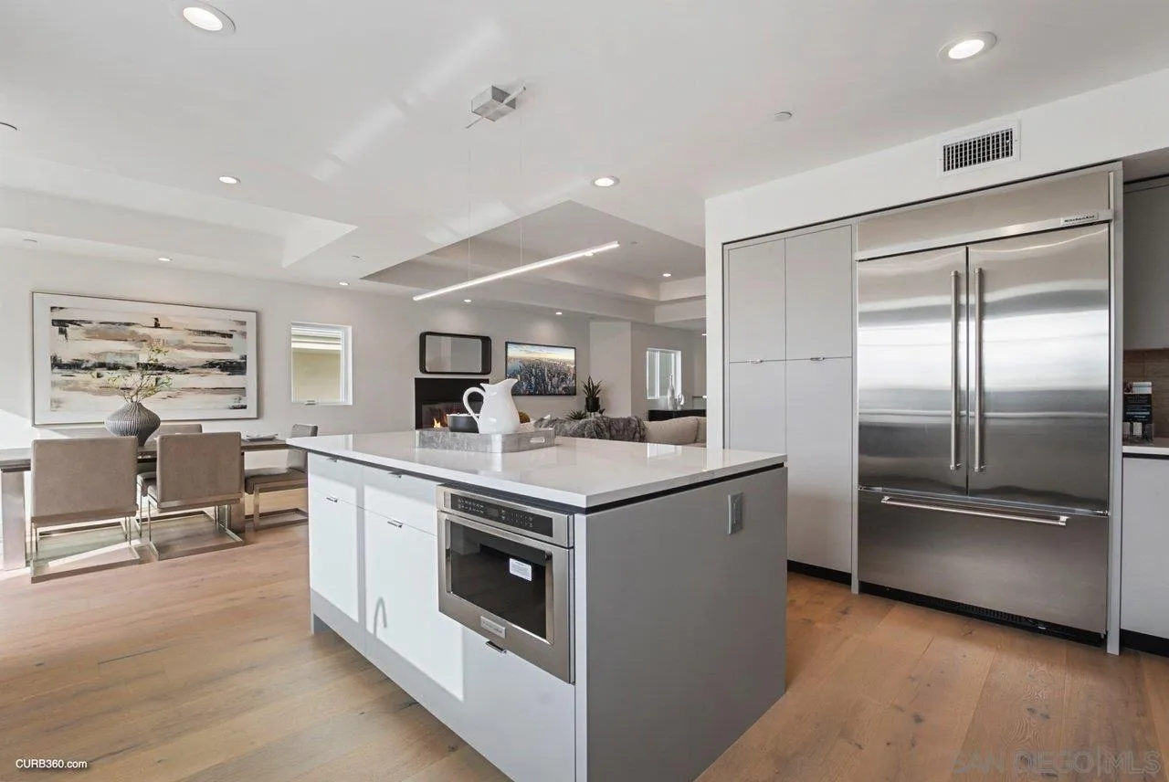 8352 La Jolla Shores Drive La Jolla, CA 92037 - Photo 13 of 33 a kitchen with stainless steel appliances granite countertop a stove and a refrigerator