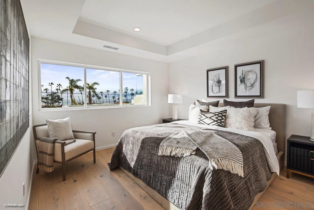8352 La Jolla Shores Drive La Jolla, CA 92037 - Photo 15 of 33 a bedroom with a bed and a couch