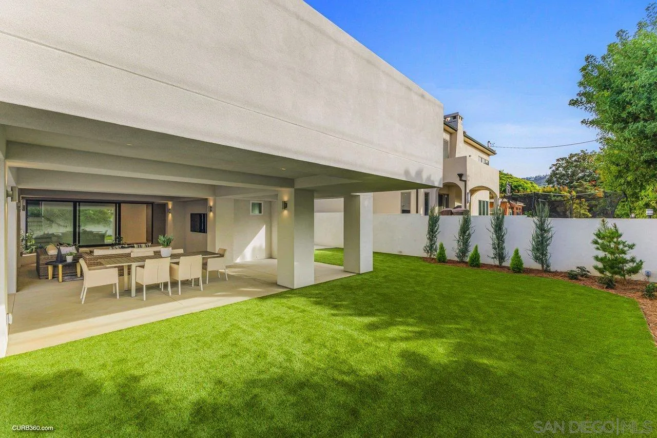 8352 La Jolla Shores Drive La Jolla, CA 92037 - Photo 19 of 33 a view of house with backyard and a garden