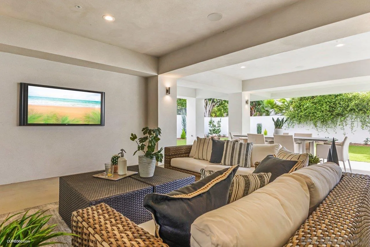 8352 La Jolla Shores Drive La Jolla, CA 92037 - Photo 22 of 33 a living room with furniture and a large window