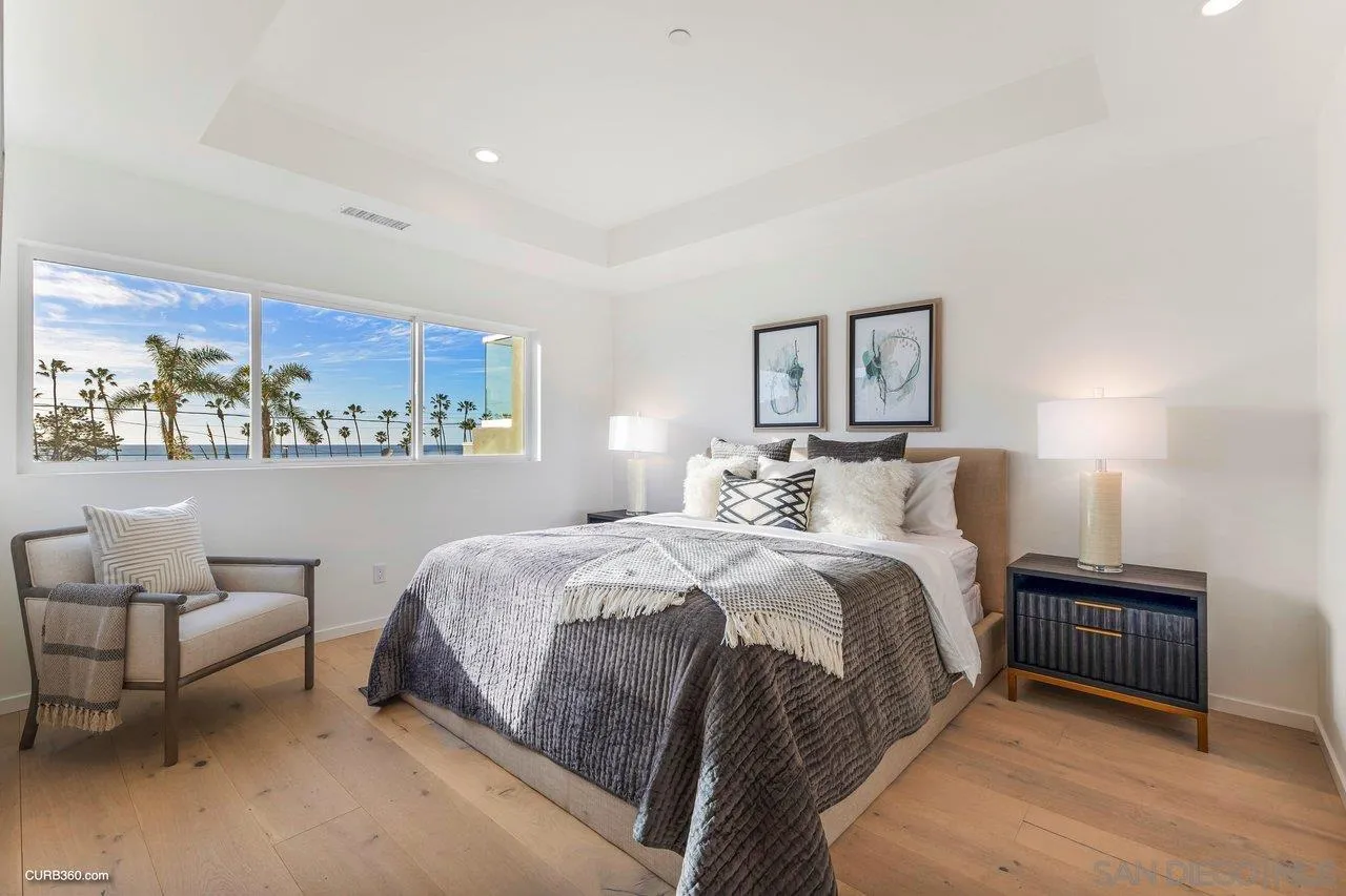 8352 La Jolla Shores Drive La Jolla, CA 92037 - Photo 26 of 33 a spacious bedroom with a bed and a couch