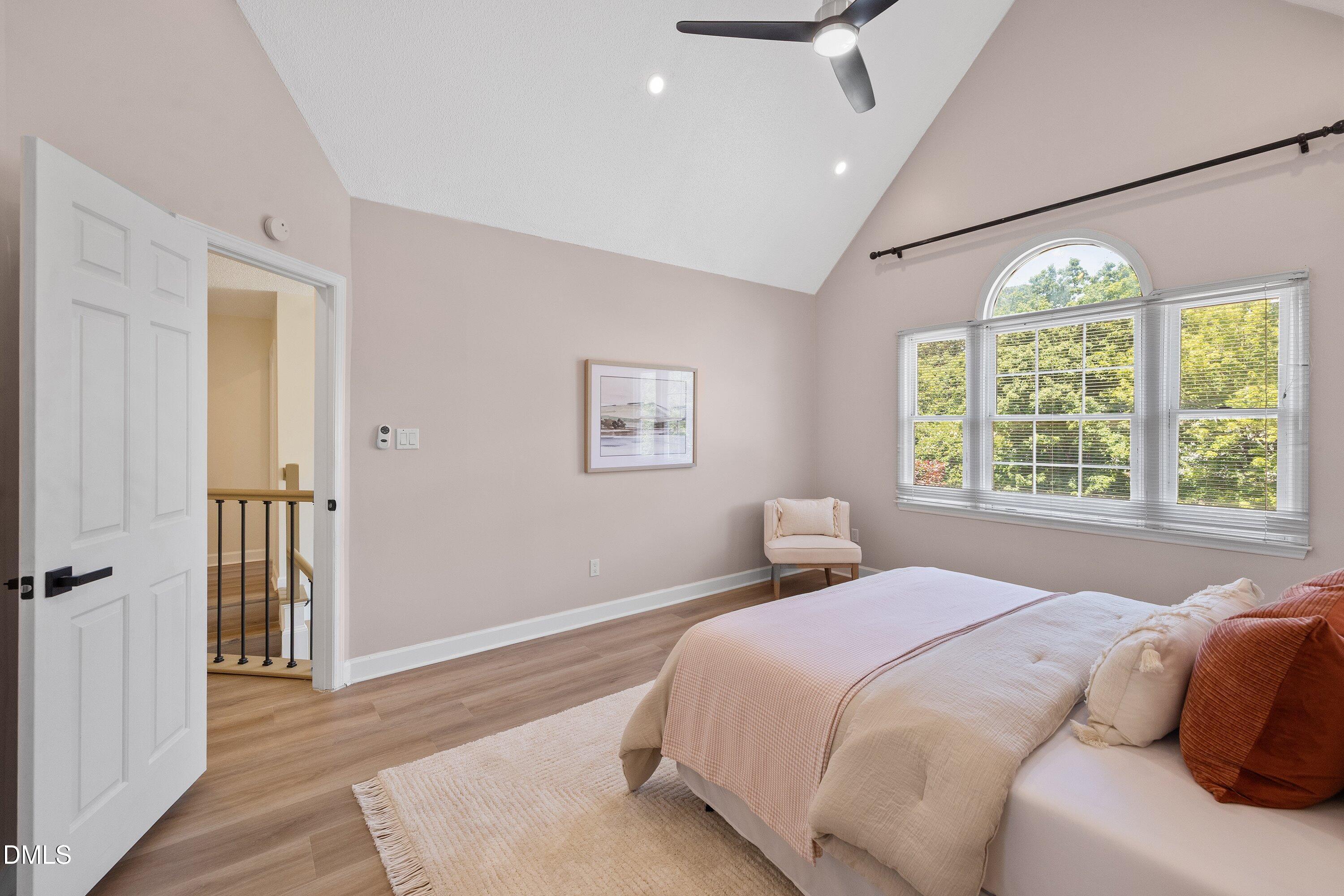 2517 Birchford Court Raleigh, NC 27604 - Photo 37 of 63 a bedroom with a large bed and a large window