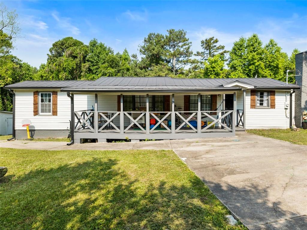 2865 Campground Road Winston, GA 30187 - Photo 1 of 1 a view of a swimming pool with table and chairs
