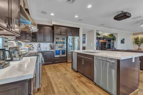 an aerial view of a house with garden space and street view