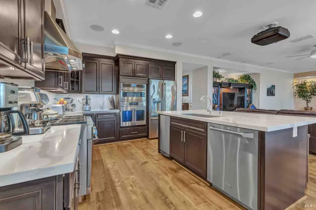an aerial view of a house with garden space and street view
