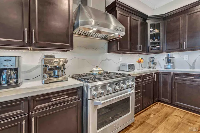 a view of a swimming pool with a garden and trees