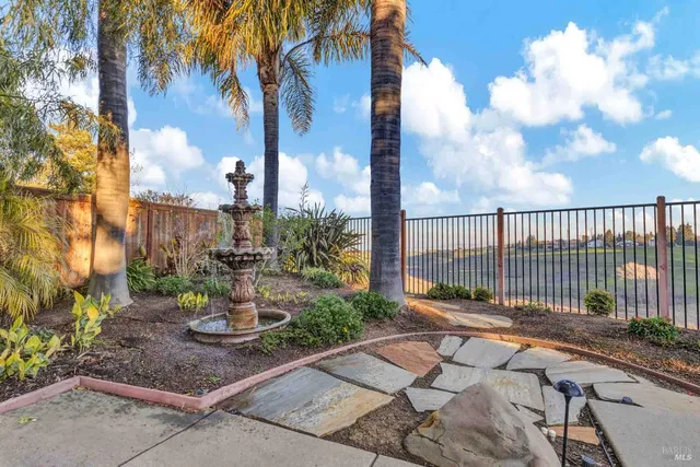 a view of a dining room with furniture a chandelier and wooden floor