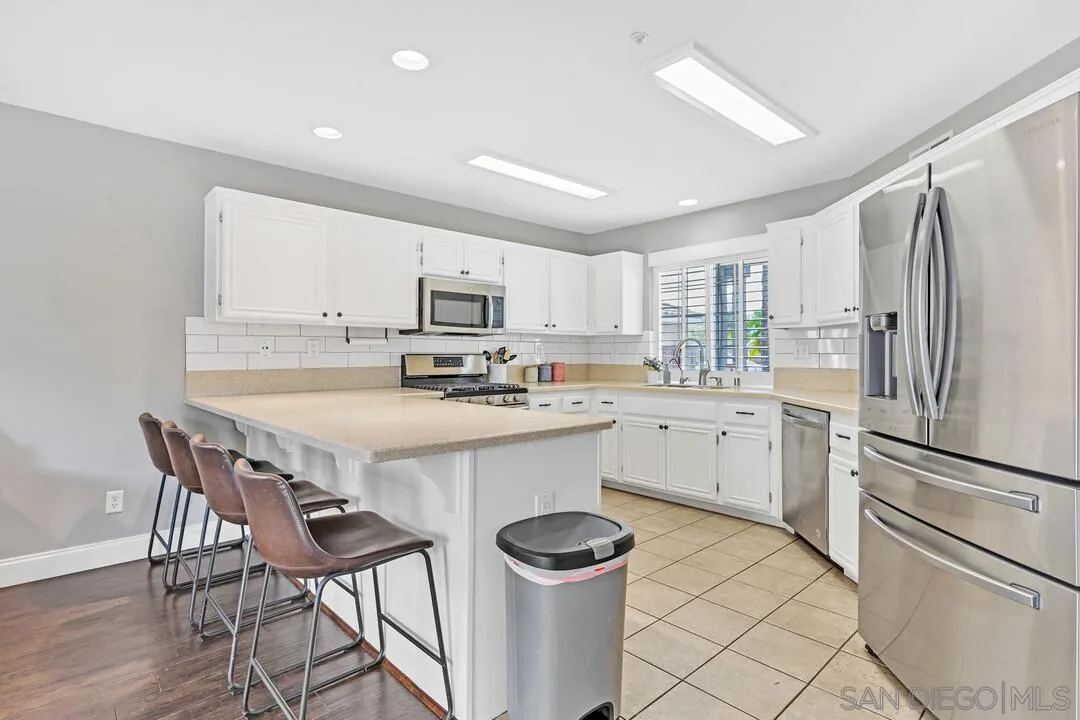 224 Parkside Place Santee, CA 92071 - Photo 15 of 50 a kitchen with a sink appliances cabinets and furniture