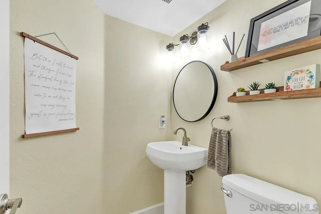 224 Parkside Place Santee, CA 92071 - Photo 20 of 50 a bathroom with a toilet sink and mirror