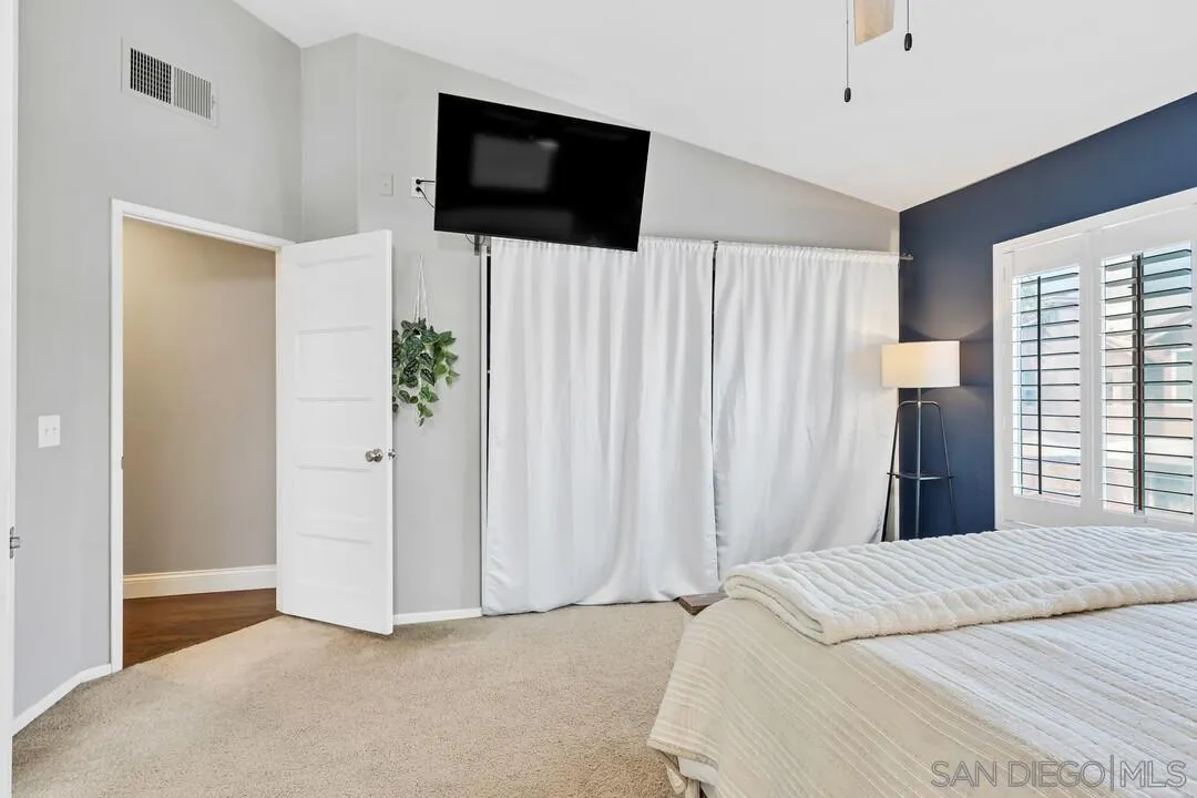 224 Parkside Place Santee, CA 92071 - Photo 23 of 50 a bedroom with a bed and a flat screen tv