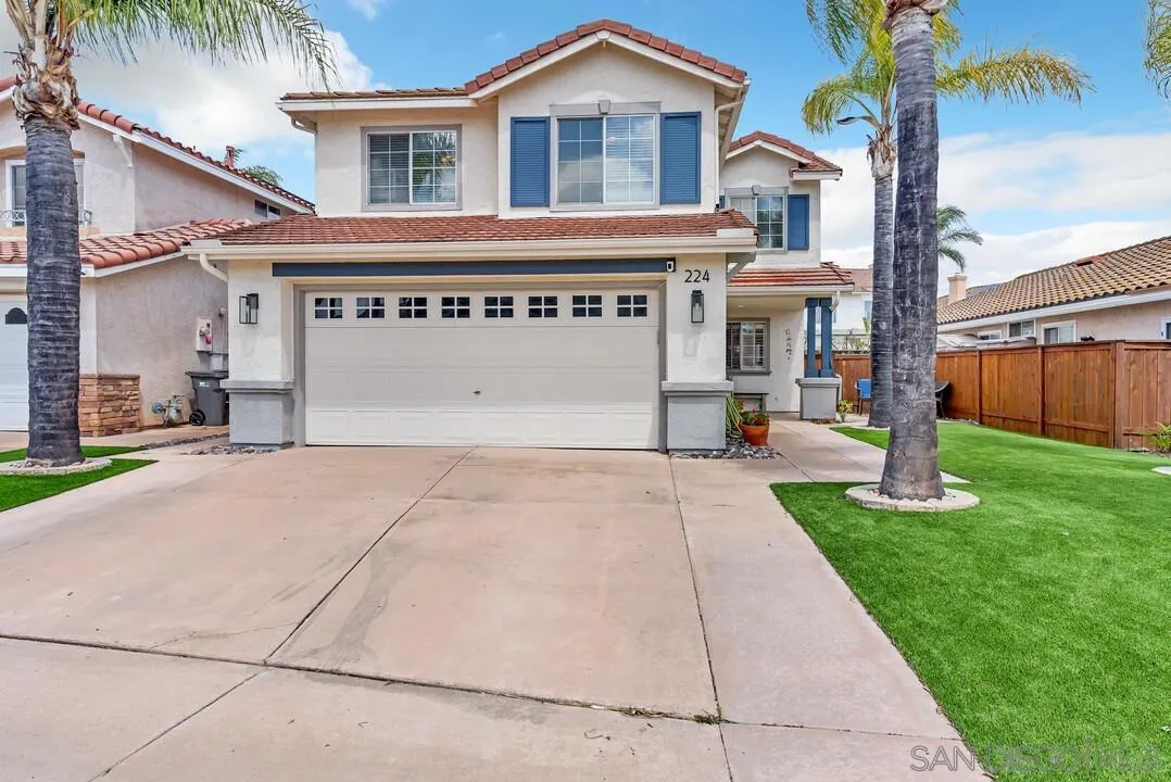 224 Parkside Place Santee, CA 92071 - Photo 3 of 50 a front view of a house with a yard and garage