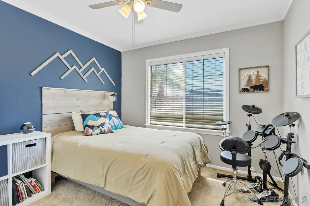 224 Parkside Place Santee, CA 92071 - Photo 35 of 50 a bedroom with a bed and a chandelier