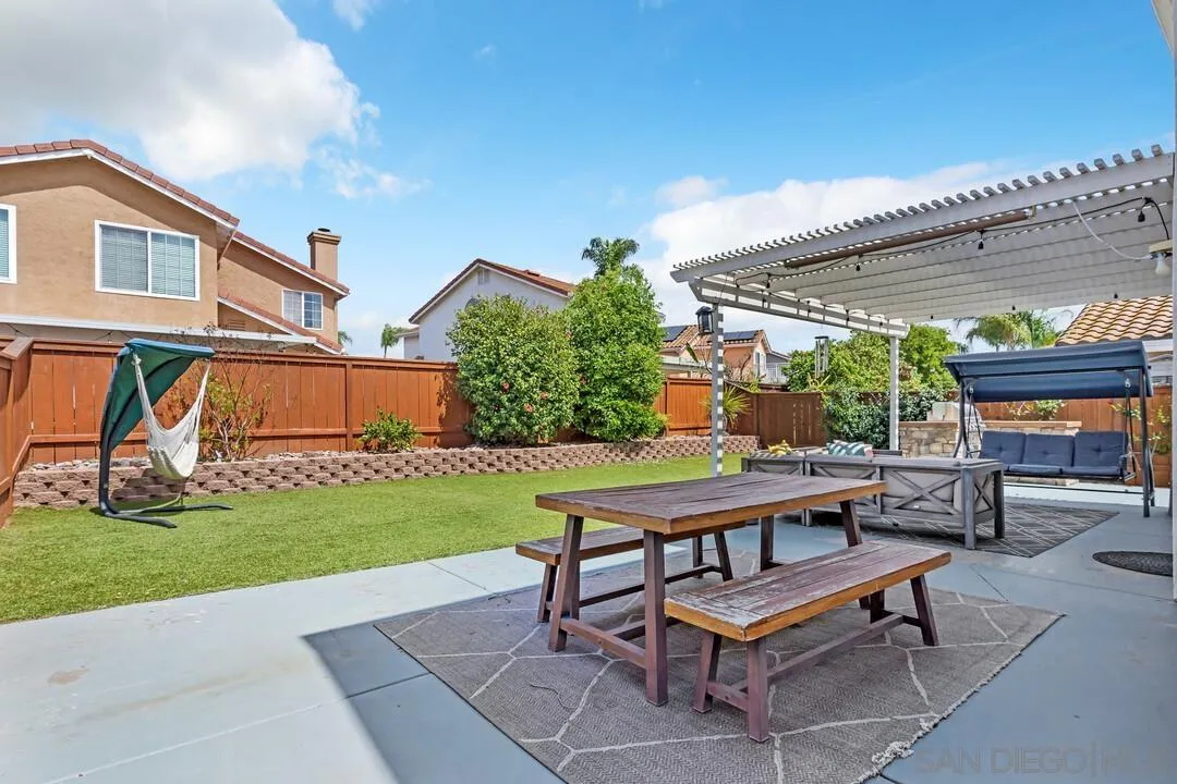 224 Parkside Place Santee, CA 92071 - Photo 41 of 50 a view of a patio with table and chairs with plants and big yard
