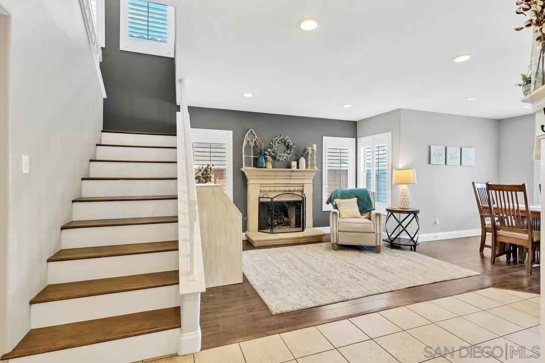224 Parkside Place Santee, CA 92071 - Photo 6 of 50 a living room with furniture a fireplace and a flat screen tv