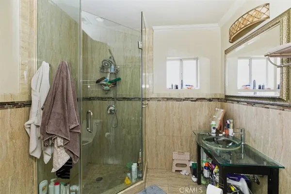 a bathroom with a sink mirror and vanity