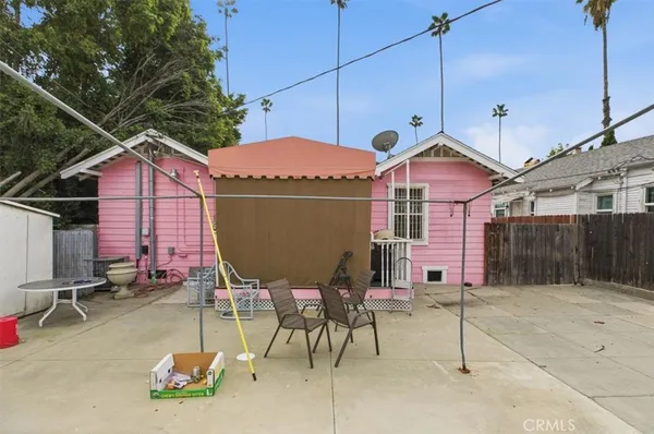 a view of a chairs and table in patio