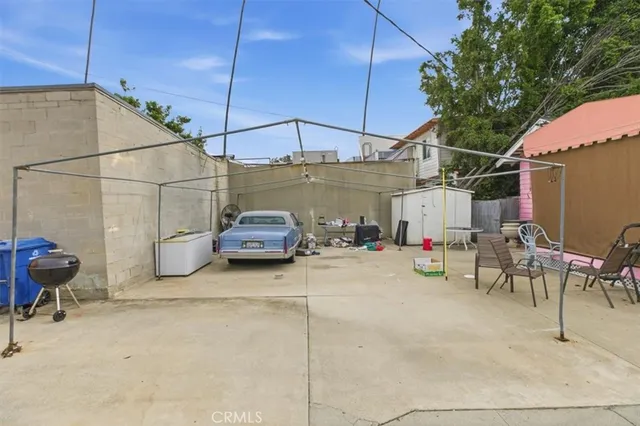 a view of a patio with table and chairs