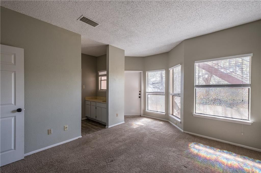 5305 Indio Cove, Unit B Austin, TX 78745 - Photo 13 of 19 a view of an empty room with a window