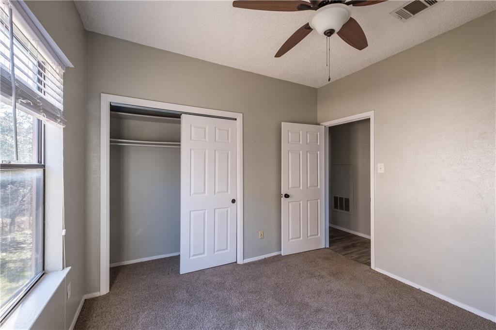 5305 Indio Cove, Unit B Austin, TX 78745 - Photo 4 of 19 a view of empty room with window and chandelier fan
