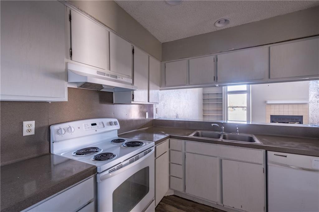 5305 Indio Cove, Unit B Austin, TX 78745 - Photo 8 of 19 a kitchen with sink a stove and cabinets