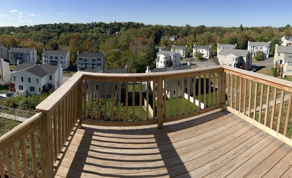36 Bittersweet Boulevard Worcester, MA 01607 - Photo 9 of 9 a view of balcony with wooden floor and fence