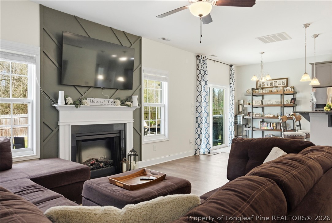 240 Meherrin Loop Raeford, NC 28376 - Photo 11 of 50 a living room with furniture and a fireplace