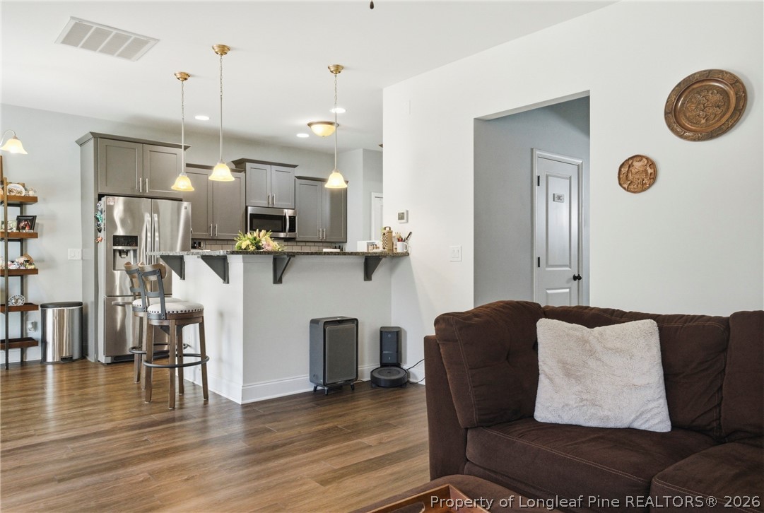 240 Meherrin Loop Raeford, NC 28376 - Photo 12 of 50 a living room with furniture and kitchen view