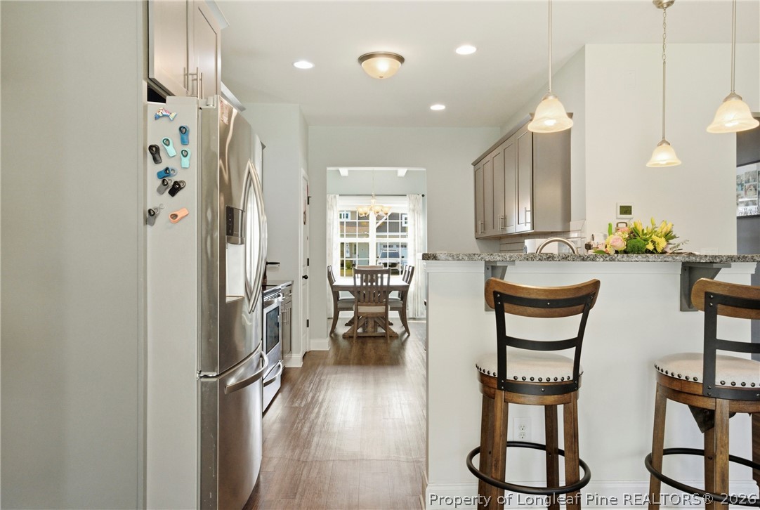240 Meherrin Loop Raeford, NC 28376 - Photo 16 of 50 a kitchen with refrigerator and cabinets
