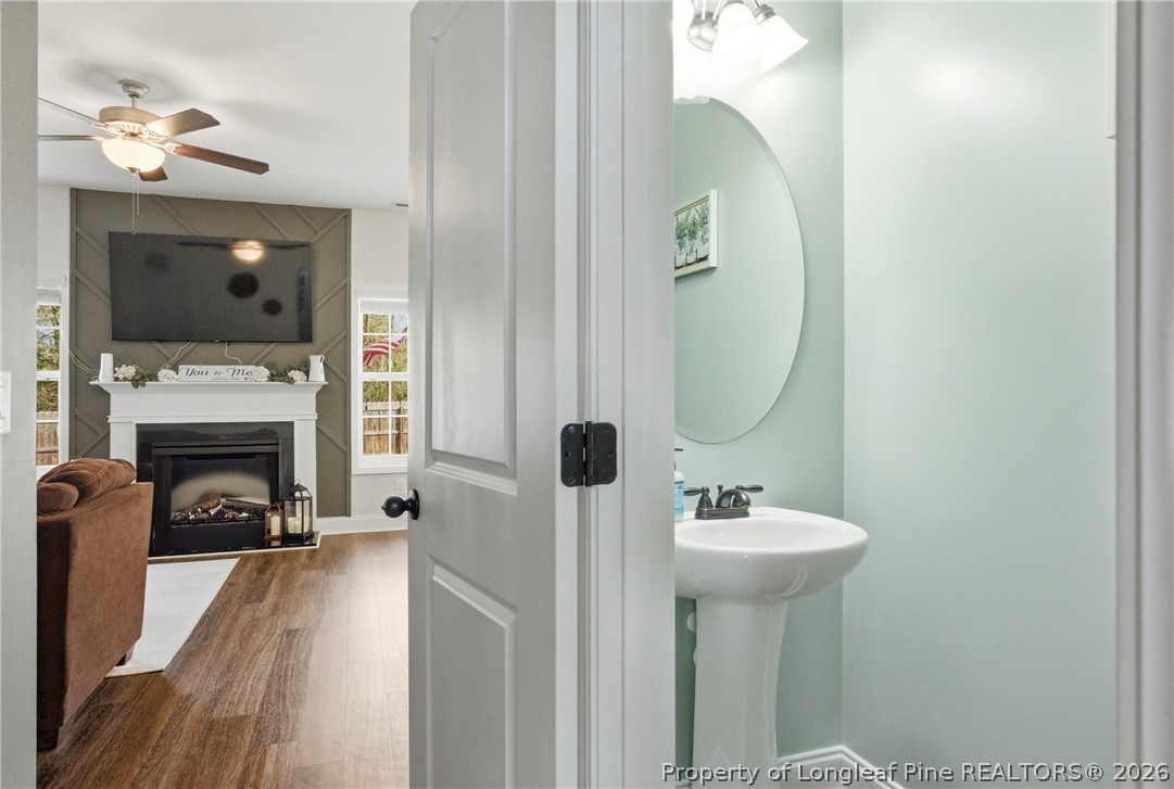 240 Meherrin Loop Raeford, NC 28376 - Photo 20 of 50 a en suite bathroom with a sink and a mirror