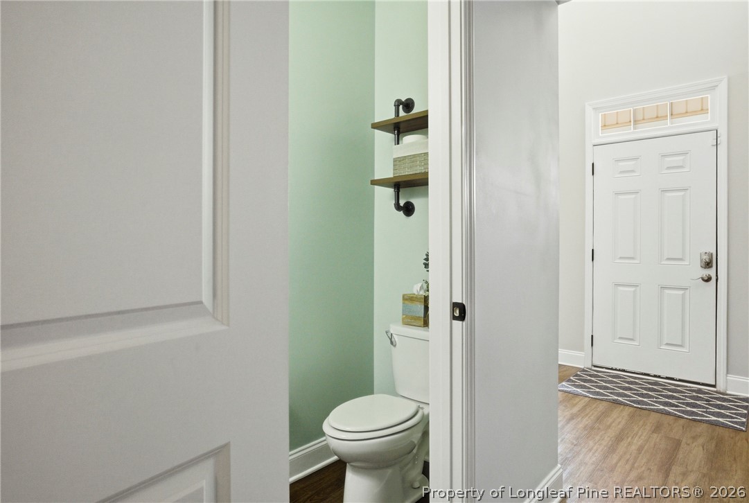240 Meherrin Loop Raeford, NC 28376 - Photo 21 of 50 a bathroom with a toilet and a shower