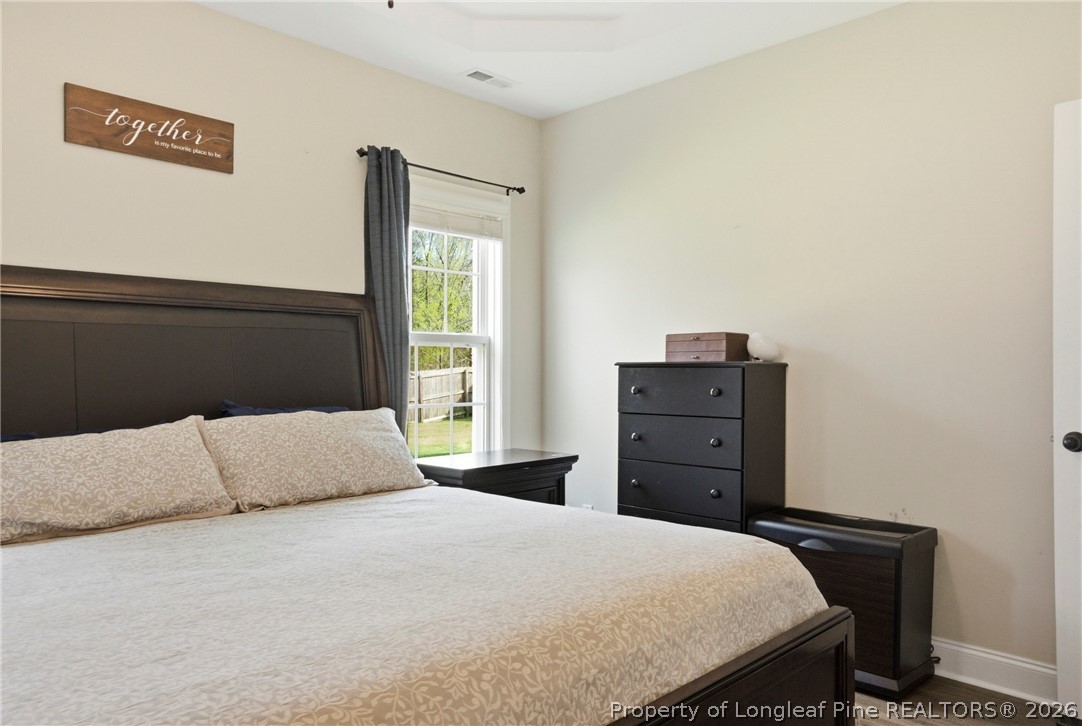 240 Meherrin Loop Raeford, NC 28376 - Photo 24 of 50 a bedroom with a bed and dresser