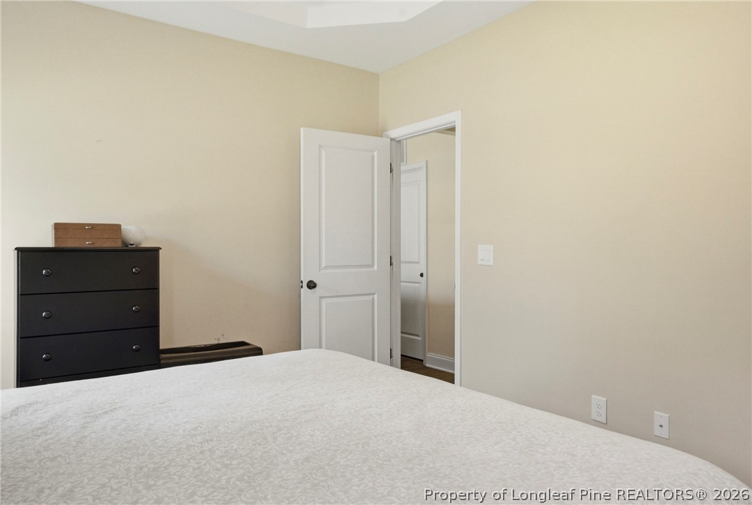 240 Meherrin Loop Raeford, NC 28376 - Photo 25 of 50 a bedroom with a bed and a dresser