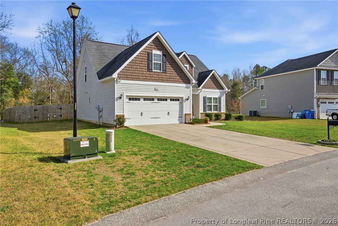 240 Meherrin Loop Raeford, NC 28376 - Photo 3 of 50 a front view of a house with a yard