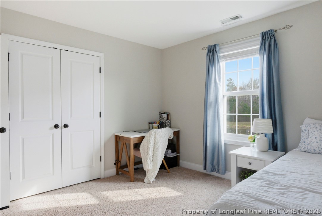 240 Meherrin Loop Raeford, NC 28376 - Photo 34 of 50 a room with a bed and a window