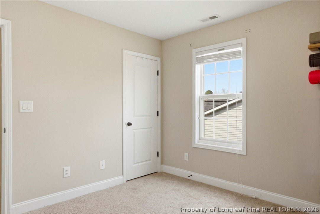 240 Meherrin Loop Raeford, NC 28376 - Photo 41 of 50 an empty room with windows and closet