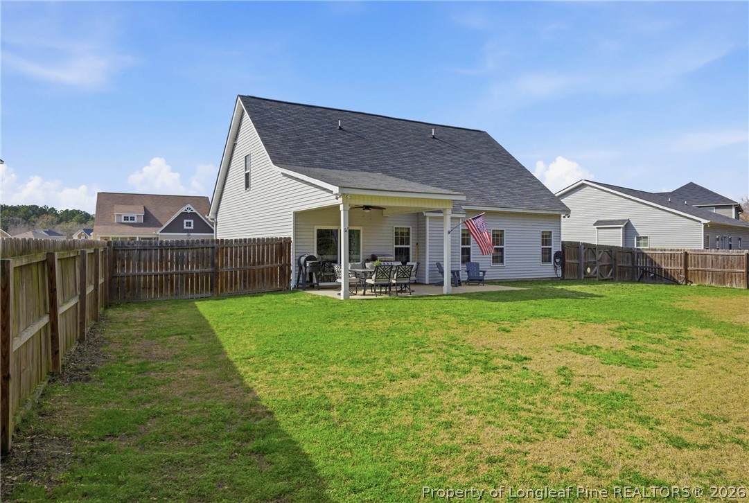 240 Meherrin Loop Raeford, NC 28376 - Photo 47 of 50 a view of a house with backyard and porch