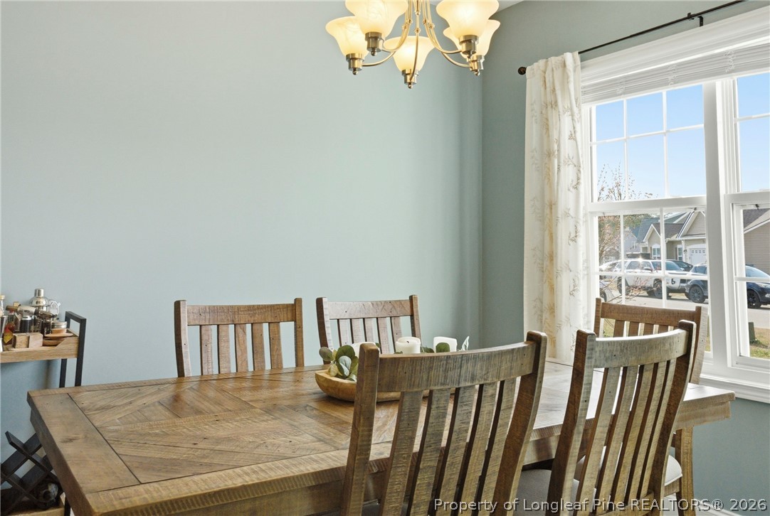 240 Meherrin Loop Raeford, NC 28376 - Photo 6 of 50 a view of a dining room with furniture and wooden floor