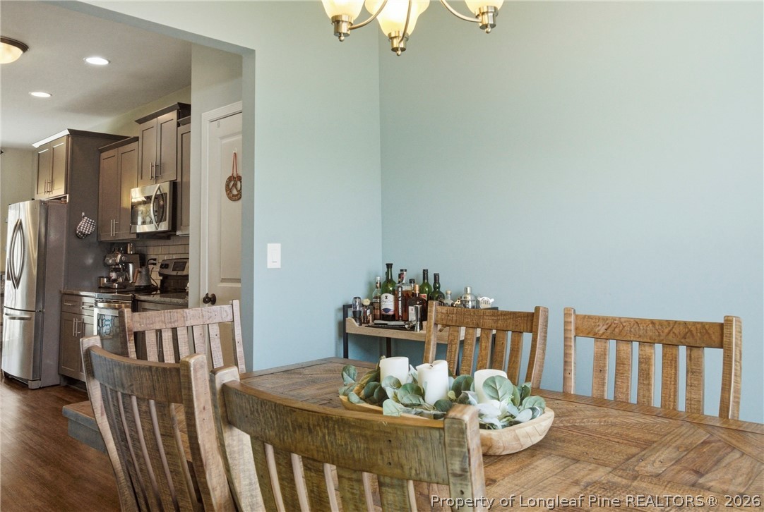 240 Meherrin Loop Raeford, NC 28376 - Photo 9 of 50 a dining room with furniture and wooden floor
