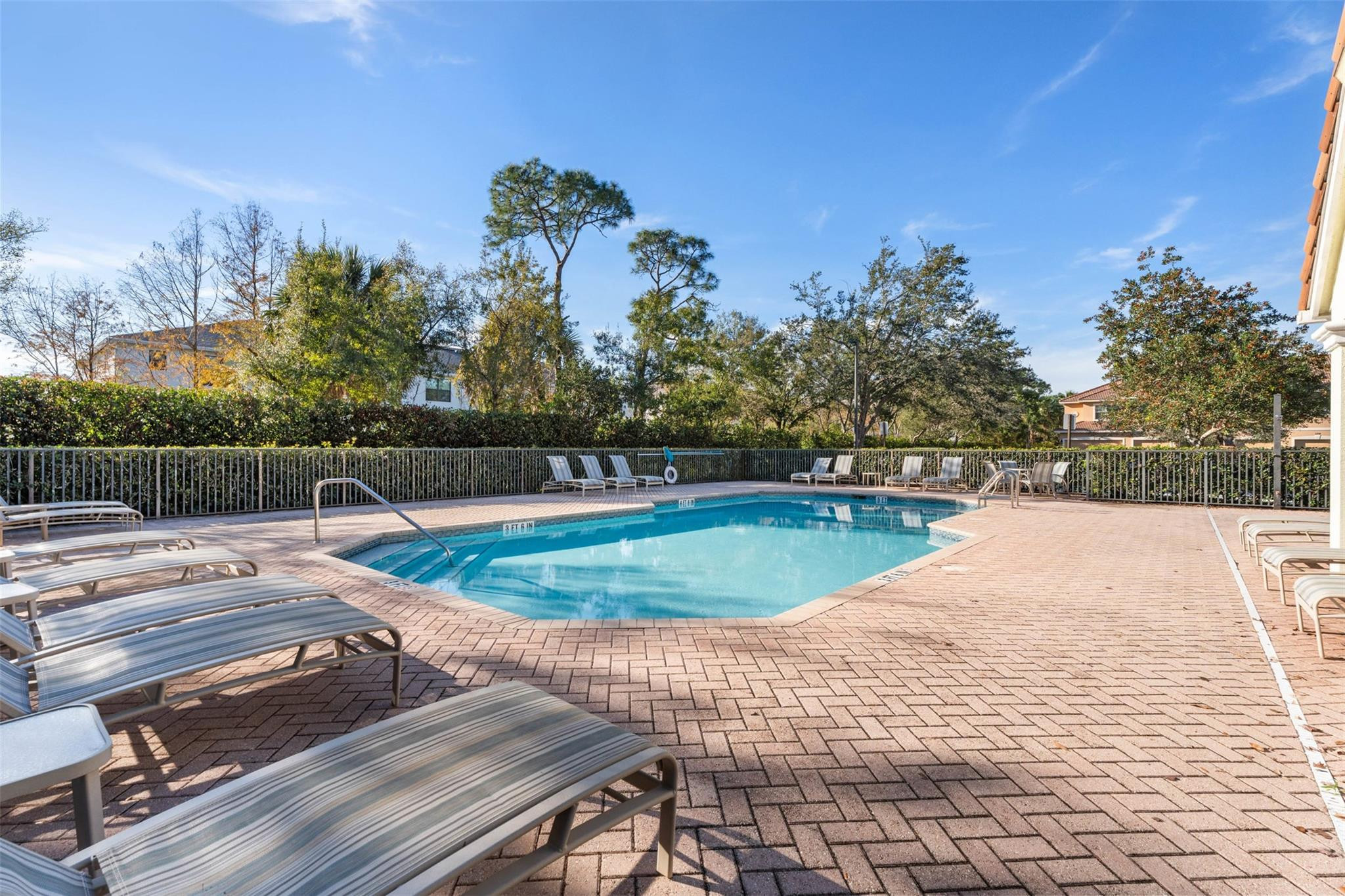 651 Southwest Glen Crest Way, Unit 2 Stuart, FL 34997 - Photo 34 of 41 a view of a swimming pool with a patio
