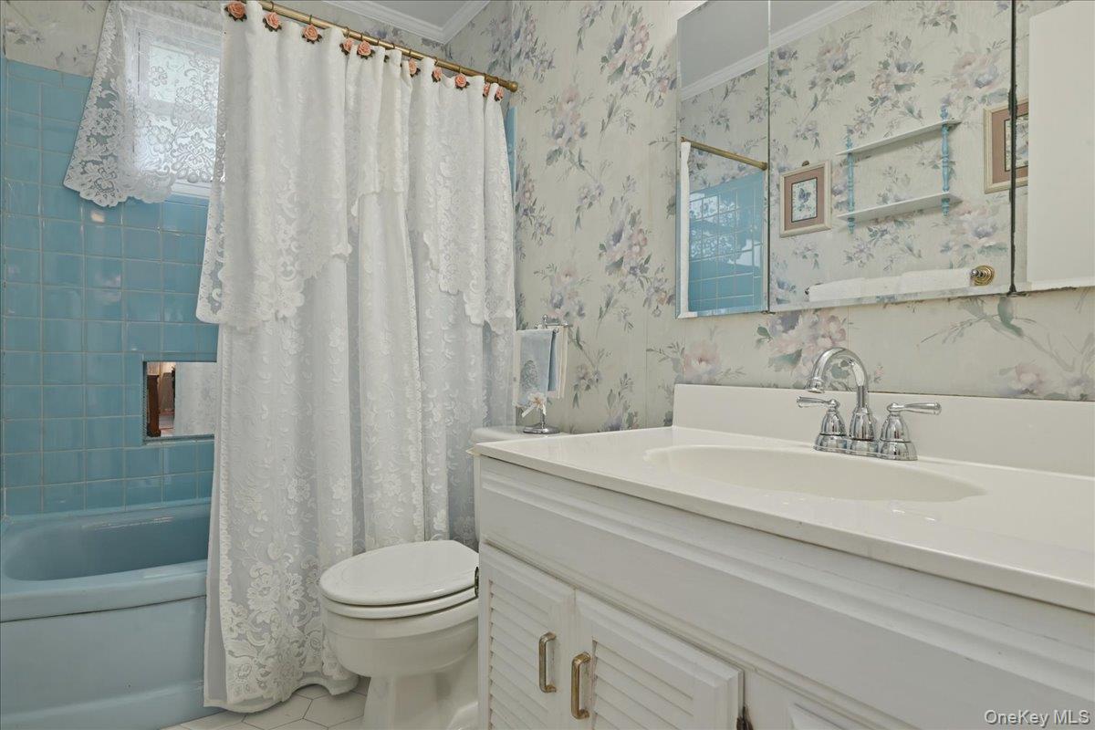 17 Avon Road Farmingdale, NY 11735 - Photo 24 of 46 a bathroom with a sink a toilet and shower