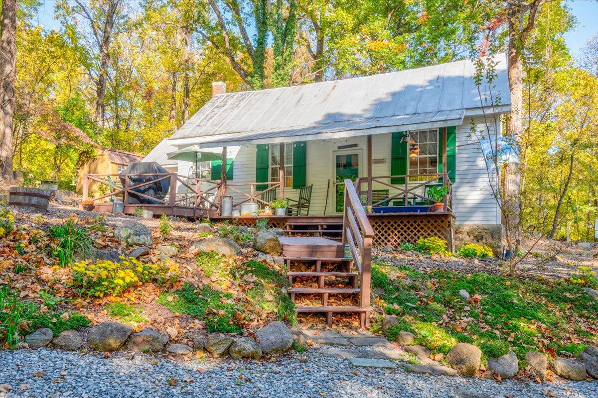 1017 Karnes Road Bedford, VA 24523 - Photo 2 of 56 a view of a house with backyard sitting area and garden