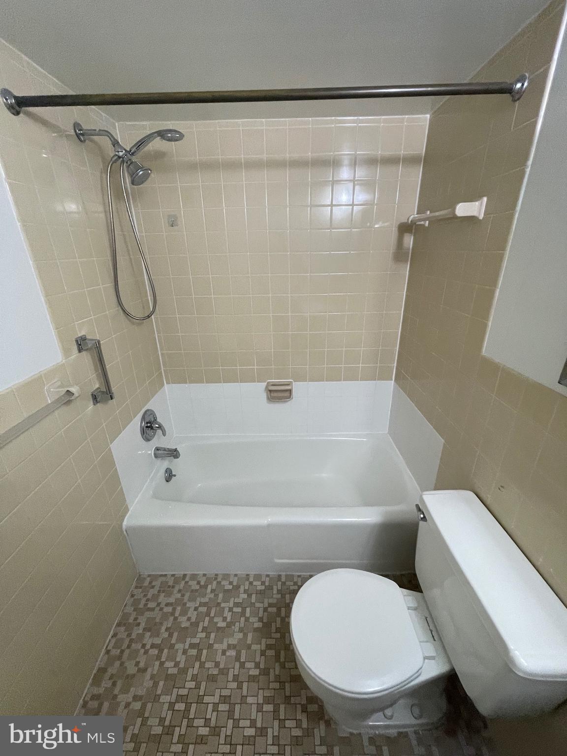 1111 University Boulevard West, Unit 1214A Silver Spring, MD 20902 - Photo 11 of 24 a bathroom with a toilet and a shower