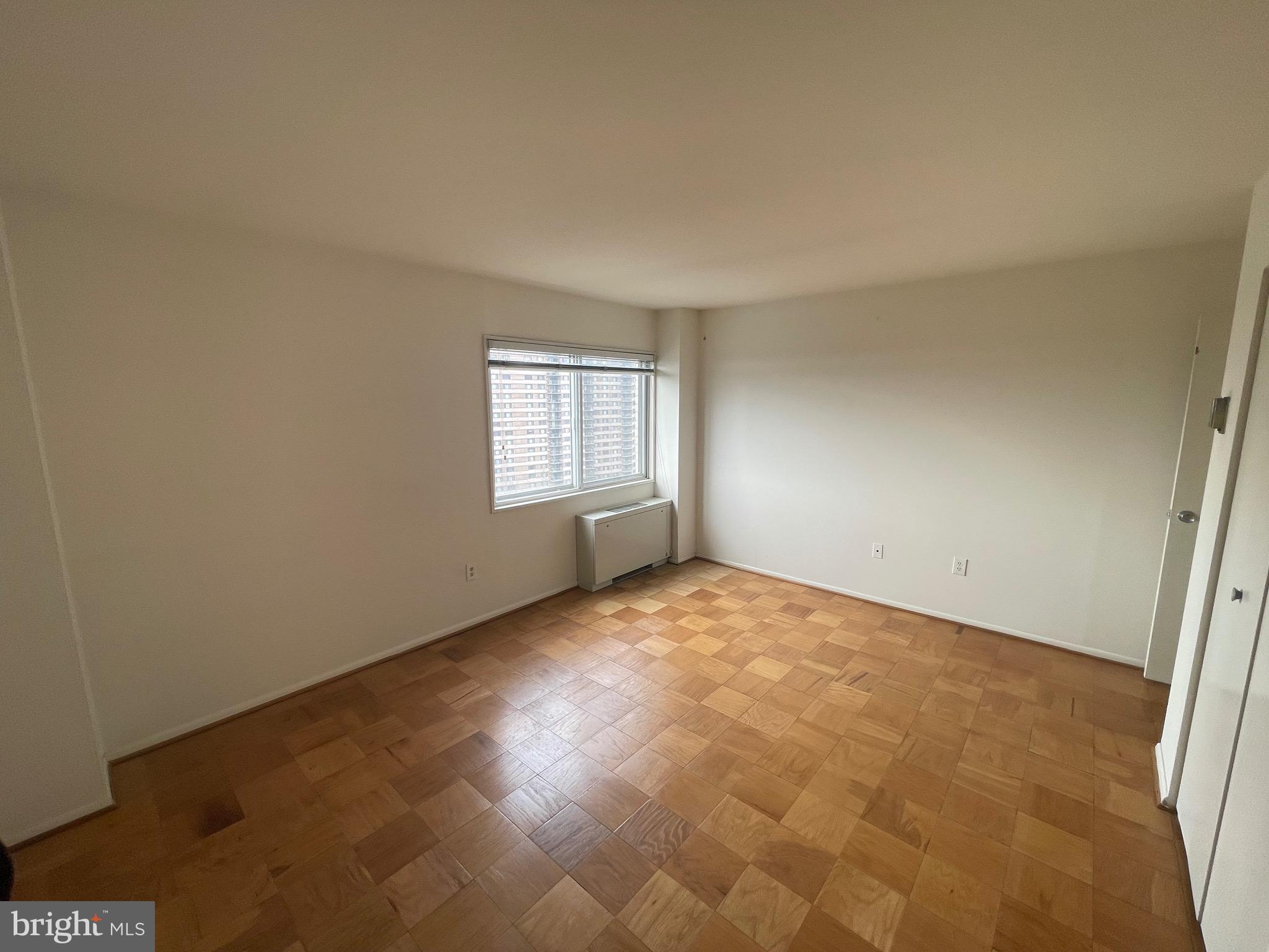 1111 University Boulevard West, Unit 1214A Silver Spring, MD 20902 - Photo 13 of 24 an empty room with windows