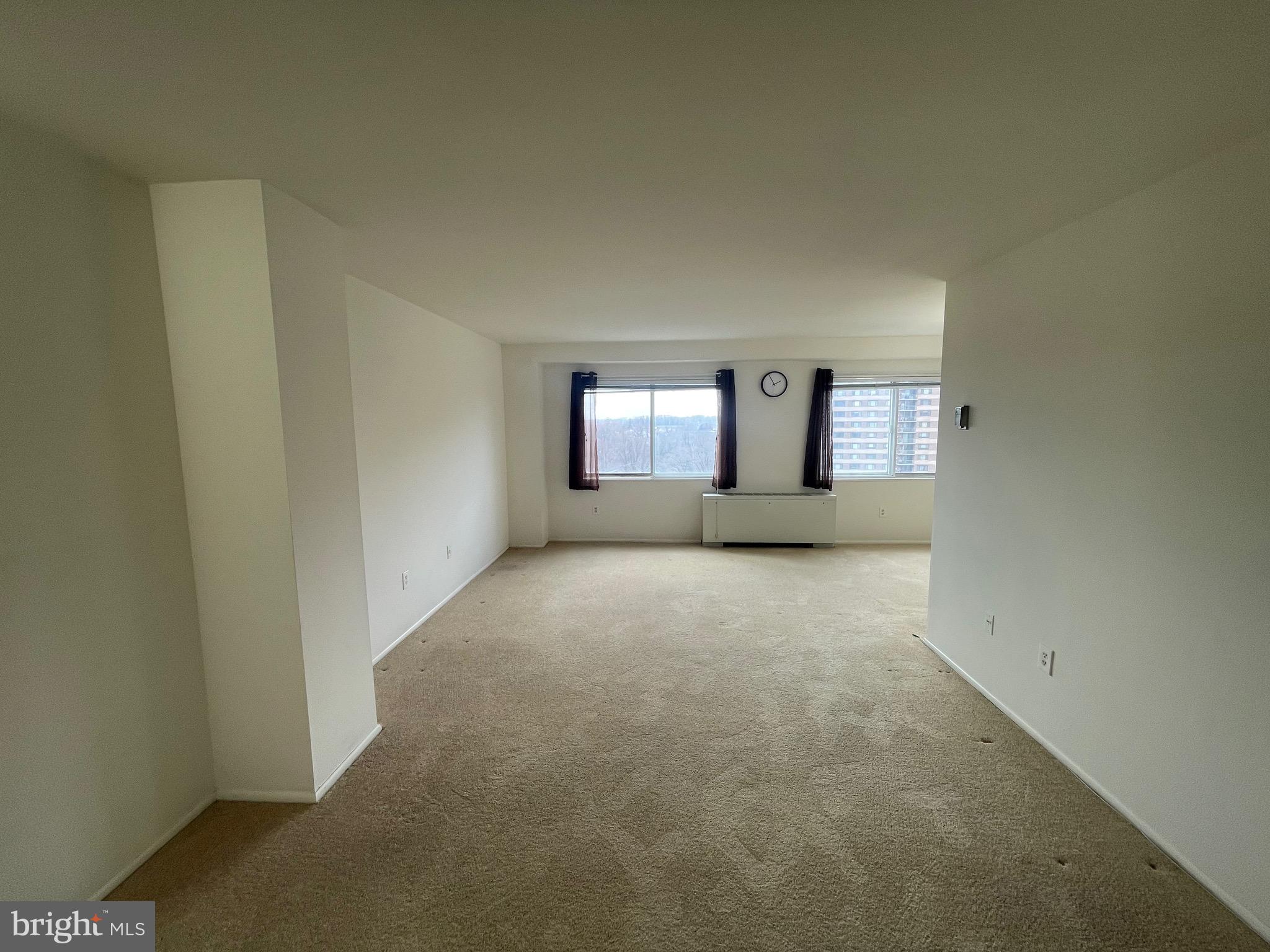1111 University Boulevard West, Unit 1214A Silver Spring, MD 20902 - Photo 3 of 24 a view of an empty room and window