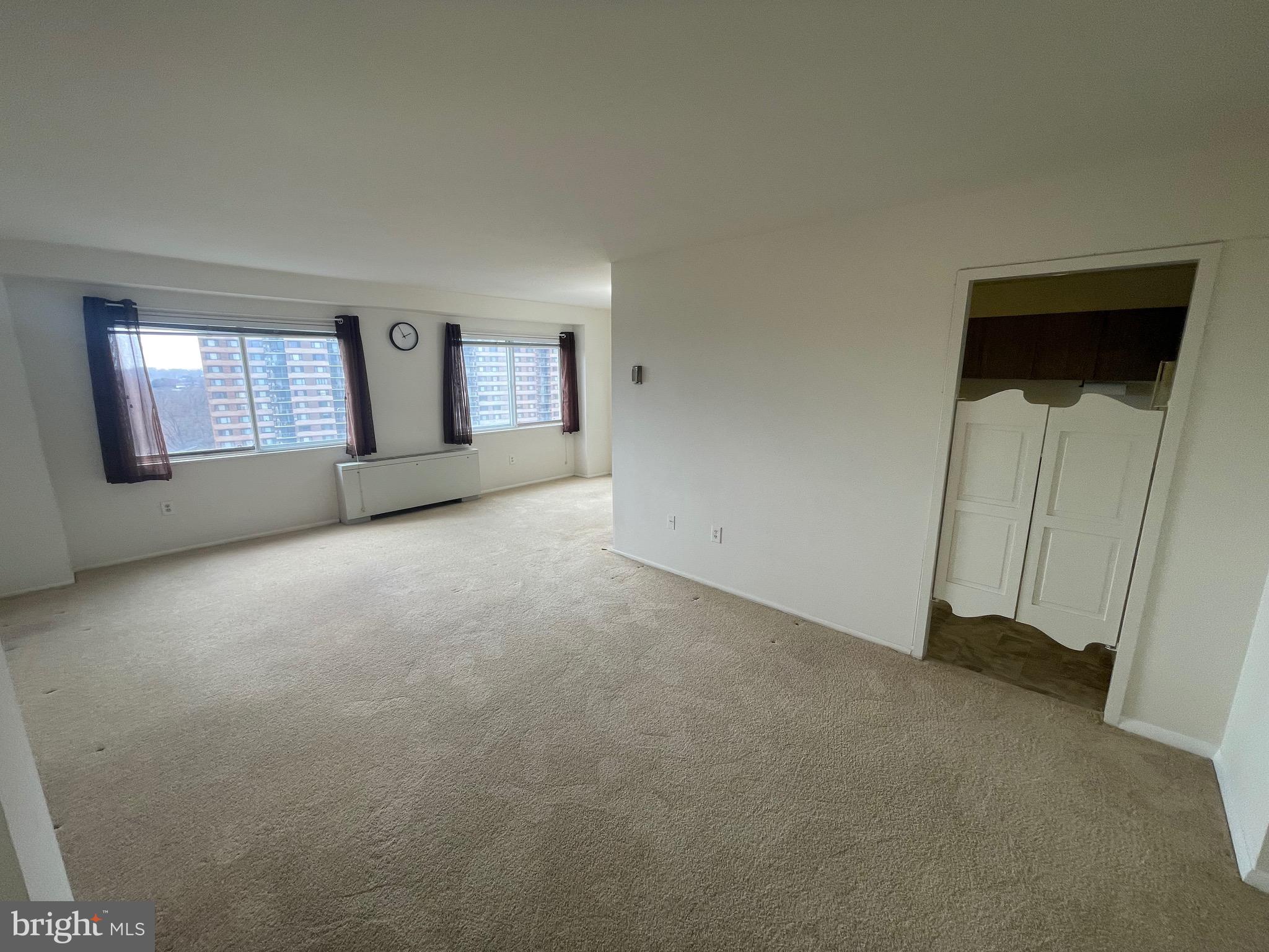 1111 University Boulevard West, Unit 1214A Silver Spring, MD 20902 - Photo 4 of 24 a view of empty room with window