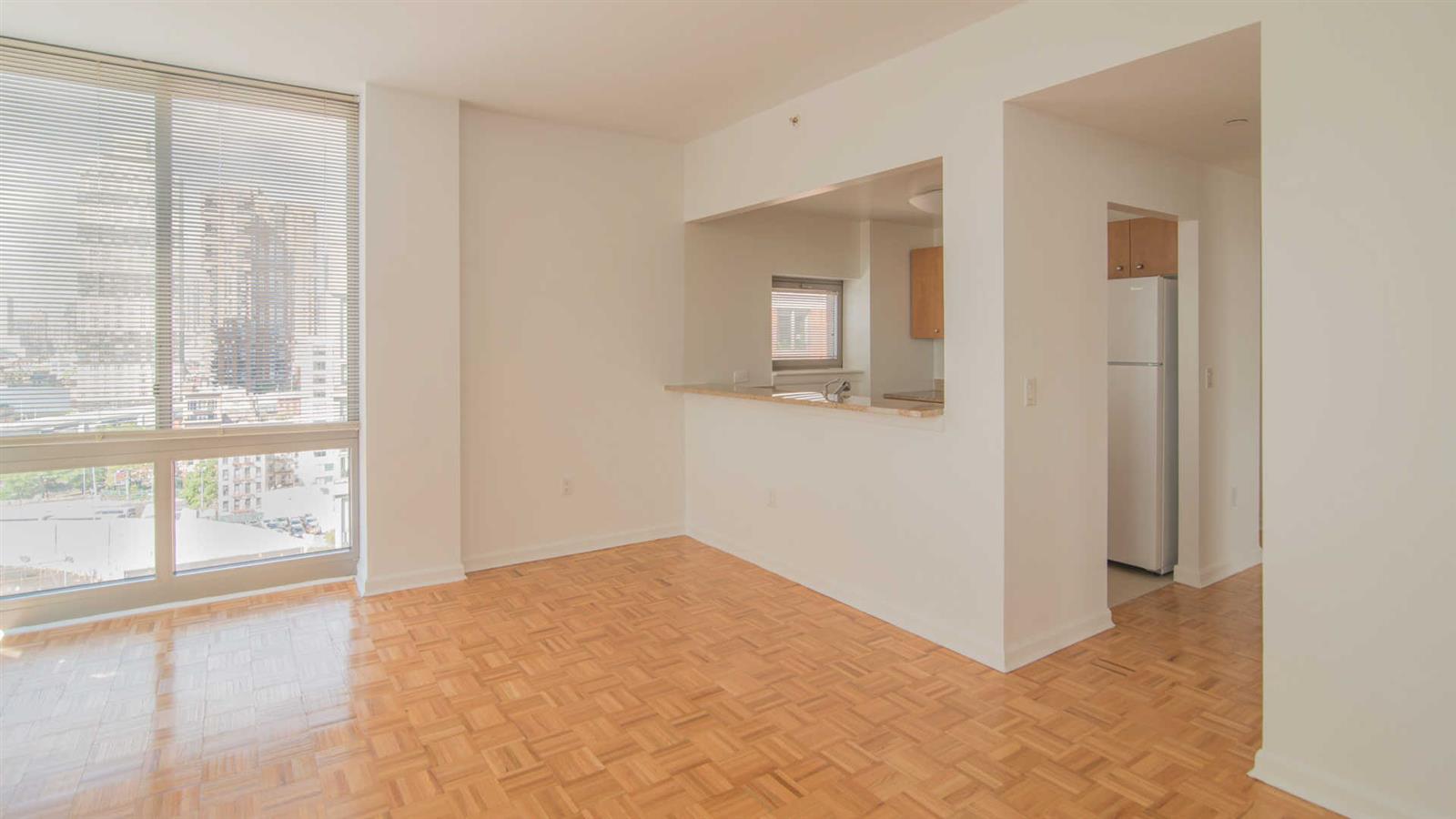400 West 37th Street, Unit 15F Manhattan, NY 10018 - Photo 7 of 10 a view of an empty room with a window