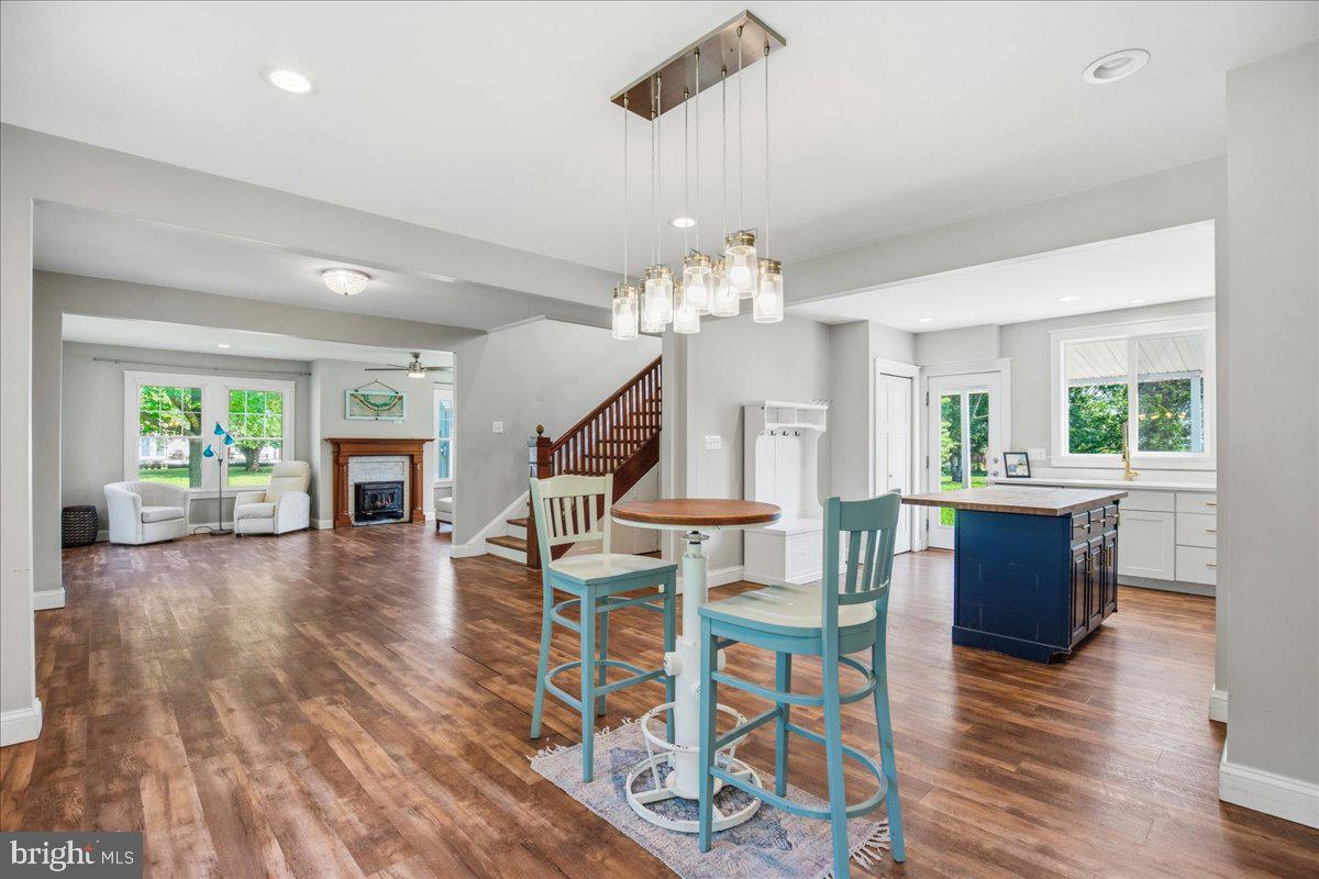 16146 Thomas Road Piney Point, MD 20674 - Photo 20 of 70 a view of a livingroom with furniture wooden floor and chandelier