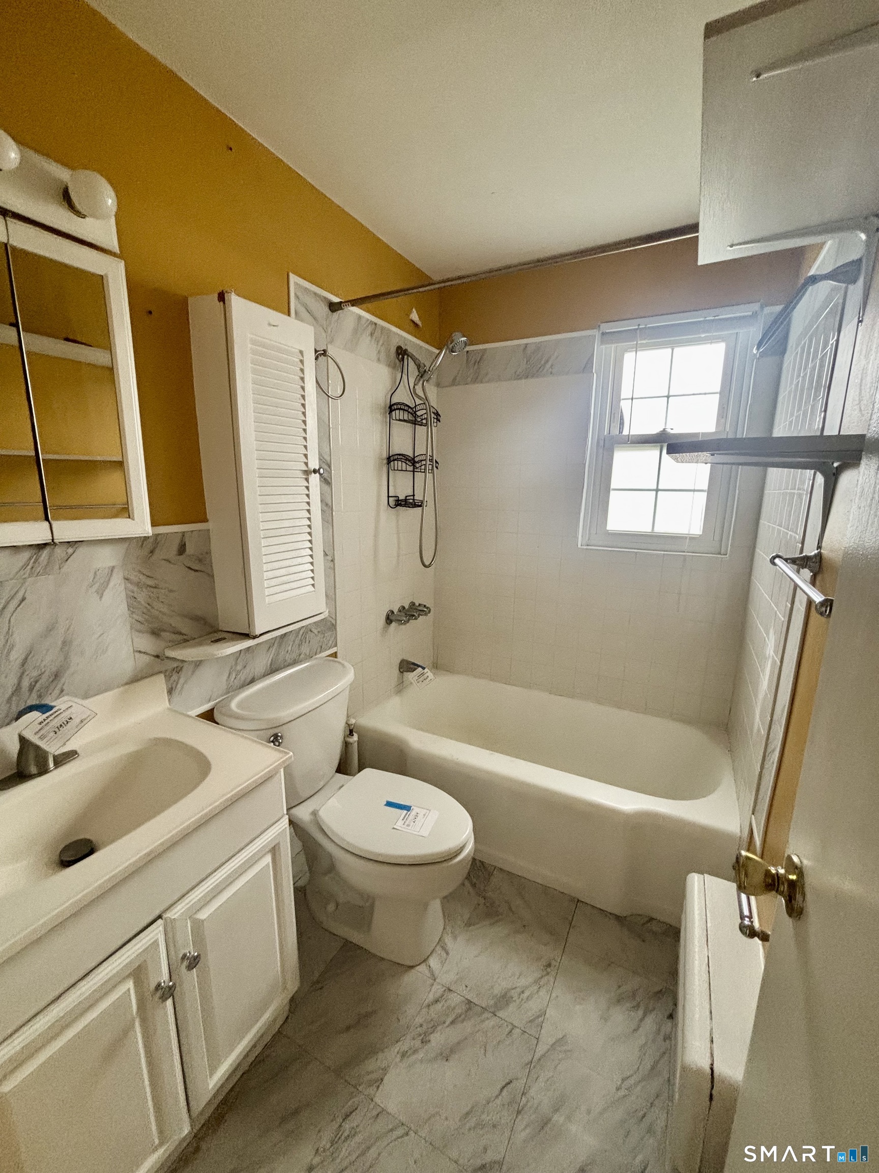 74 Standish Road, Unit 3 Stamford, CT 06902 - Photo 21 of 22 a bathroom with a sink toilet and shower