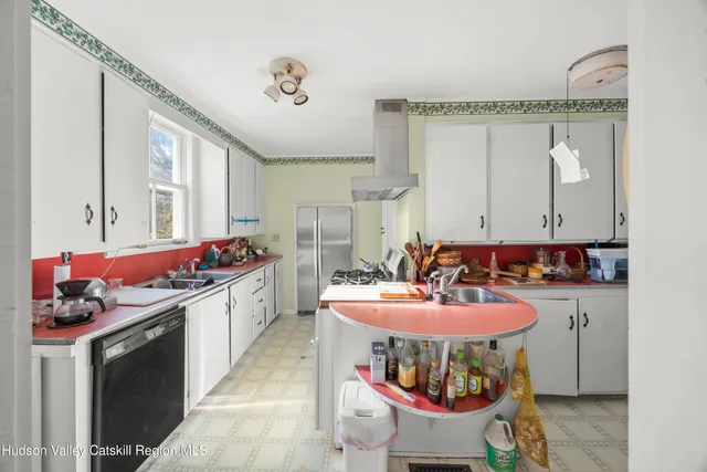 a room with furniture a chandelier and a couch